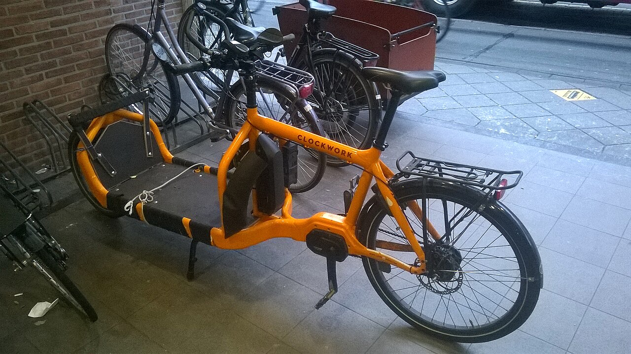 Orange Bullitt Clockwork cargo bicycle parked in Utrecht